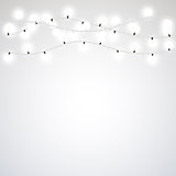 White garland style Christmas lights on the gray background. Vector design element.