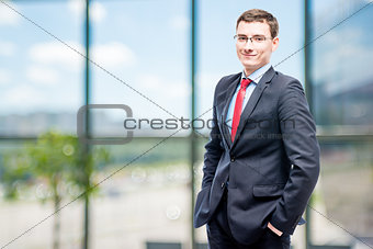 Successful businessman posing in office
