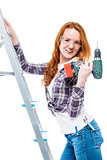 sexy young woman with a drill on a white background