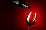 Wineglass on a red background