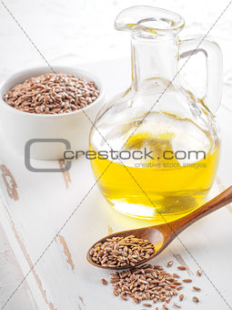 Brown flax seeds and flaxseed oil close up
