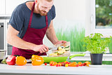 Man preparing food for cooking in kitchen