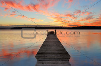 Sunset over St Georges Basin with timber jetty