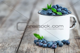 Blueberry in mug background
