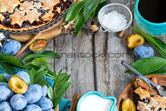 Plum pie with cinamon and almonds background