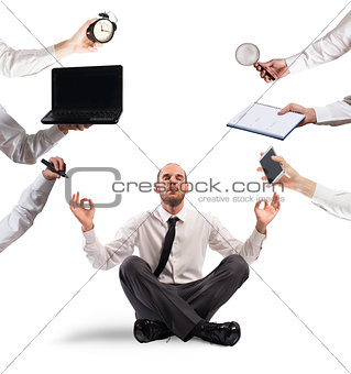 Relaxed businessman that does yoga during the work