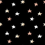 Black festive packaging paper with Christmas stars made of gold and bronze foil. Seamless vector pattern.