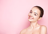 Beauty girl natural makeup with cute smile on pink