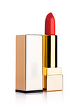 Golden container of luxury cosmetic red lipstick 