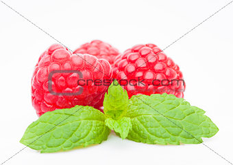 Fresh healthy red raspberries with mint leaf