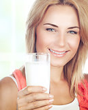 Healthy girl drinking milk