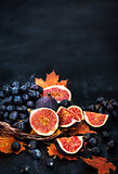 Autumnal fresh ripe figs and purple grape