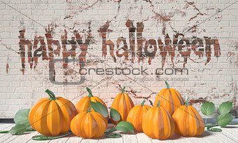 Happy Halloween greeting with pumpkins and green leafs on wooden