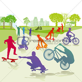 Children with skateboard and bicycle in the park