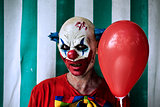 scary evil clown in the circus