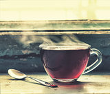A cup of hot tea at the window.