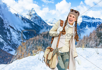 happy woman against mountain scenery in South Tyrol, Italy