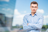 Businessman in glasses young and very successful,  in office