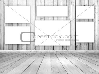 3D wooden room interior with blank hanging canvases