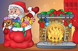 Santa Claus with gifts by fireplace