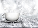 3D cup and saucer on wooden table against Christmas snowflake ba