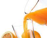 Pouring refreshing orange juice into a glass