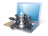 Chess pieces on open laptop side view 3D