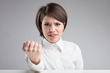 angry woman menacing to punch you