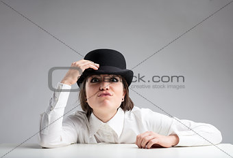 funny insolent expression of a woman in bowler