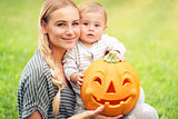 Happy family with Halloween pumpkin