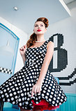 Pin up style portrait of beautiful young girl in dress. Retro (vintage)