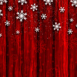 Christmas snowflakes on red wood background 