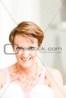 Attractive mature woman with a vivacious smile