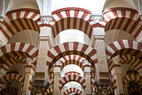 Double red-and-white colored arches inside Cordoba Mosque, Spain