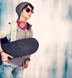 Stylish guy with skateboard