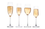Champagne glasses with bubbles on white