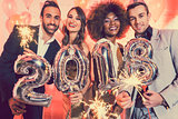 Men and women celebrating the new year 2018