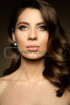 Make up. Glamour portrait of beautiful woman model with fresh makeup and romantic hairstyle.