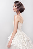 Beautiful bride with fashion wedding hairstyle - on white background.