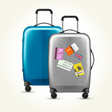 Wheeled plastic suitcases with baggage travel tags on white