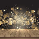 Christmas background with wooden table and golden lights 