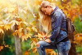 Beautiful model in autumn park