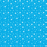 Winter seamless background with flat white snowflakes on a blue