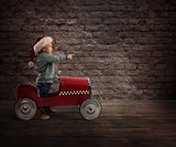 Child that play with his car waits for Santa Claus