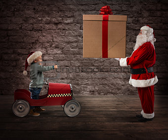 Santa Claus deliver a CHristmas gift to a child