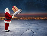 Fast delivery of Christmas gifts. Santa Claus ready to launch a rocket