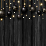 Christmas baubles and stars on a grunge wooden texture