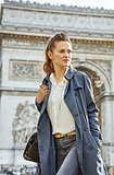 woman near Arc de Triomphe in Paris, France looking aside