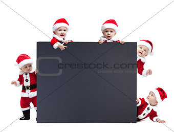 Five Santa Claus baby hold black advertisment banner blank