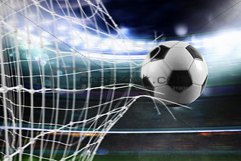 Soccer ball scores a goal on the net